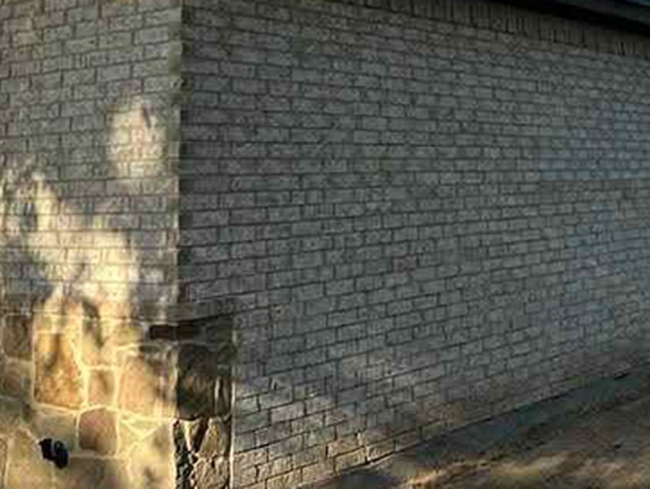 Unpainted brick wall on a Waxahachie, TX home