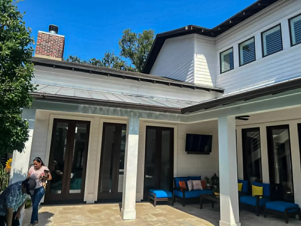 Two-story home with repainted rear elevation and patio – Kings Painting
